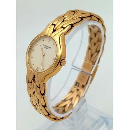 81 - A LADIES PATEK PHILIPPE 18K GOLD WATCH WITH DIAMOND NUMERALS AND UNUSUAL TWIST HANDS. 23mm