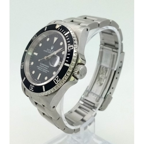 36 - A ROLEX SUBMARINER - THE ULTIMATE DIVERS WATCH IN STAINLESS STEEL WITH BLACK DIAL AND BEZEL . 40mm A... 