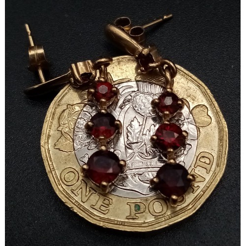 768 - A Pair of Vintage 9K Yellow Gold Graduated Garnet Drop Earrings. 2.5cm. 1.84g total weight