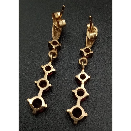 768 - A Pair of Vintage 9K Yellow Gold Graduated Garnet Drop Earrings. 2.5cm. 1.84g total weight