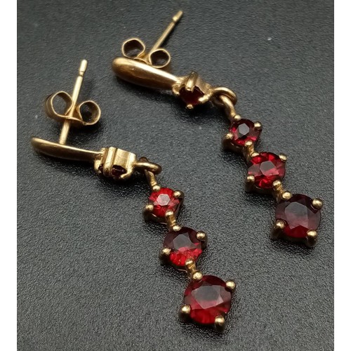 768 - A Pair of Vintage 9K Yellow Gold Graduated Garnet Drop Earrings. 2.5cm. 1.84g total weight