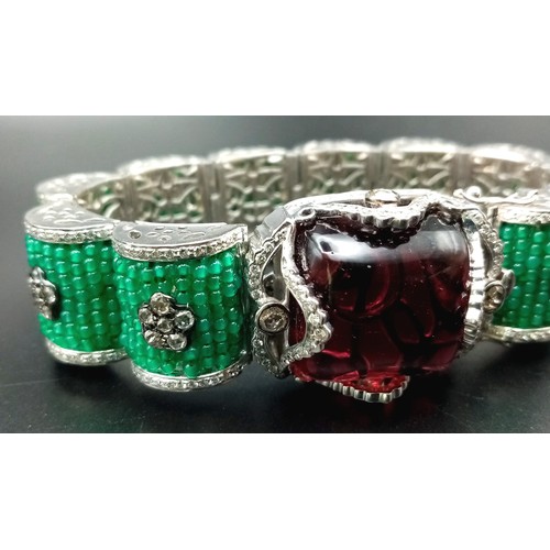 74 - A REAL STATEMENT PIECE OF JEWELLERY, A SENSATIONAL 18K WHITE GOLD BRACELET COVERED IN EMERALDS AND D... 