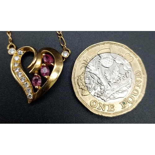 72 - An 18 k yellow gold chain necklace with a heart pendant adorned with rubies and diamonds. Length: 43... 