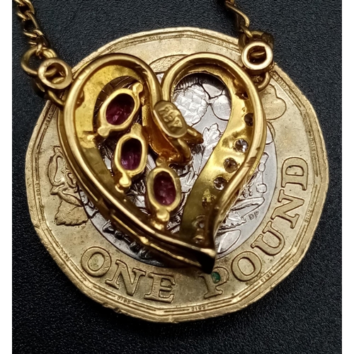 72 - An 18 k yellow gold chain necklace with a heart pendant adorned with rubies and diamonds. Length: 43... 