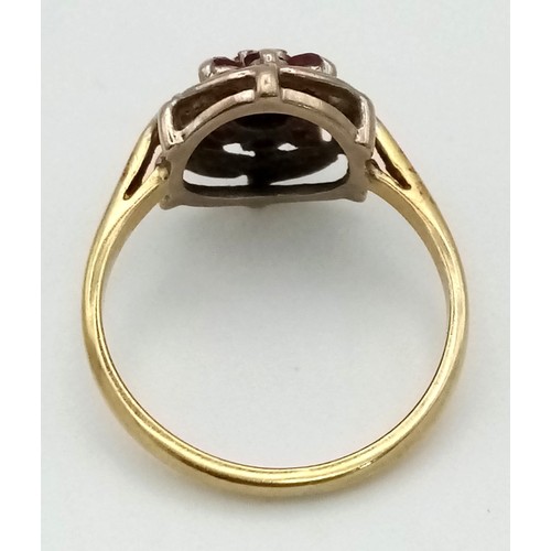 114 - An 18 K yellow gold ring with a cluster of diamonds and rubies. Ring size: N, weight: 3.3 g.