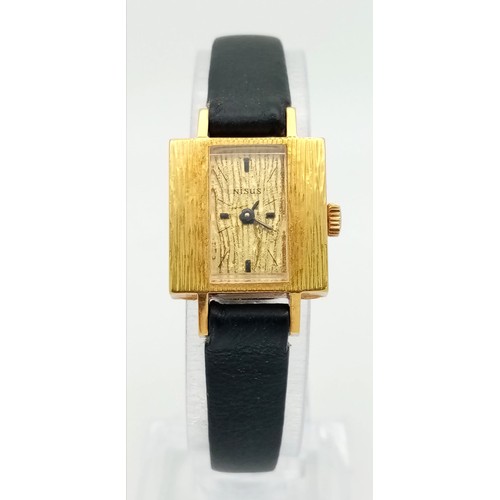 137 - A Vintage Nisus 18K Gold Ladies Watch. Black leather strap. Square 18K gold case with bark-effect de... 