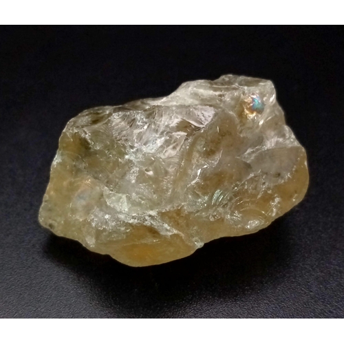 1085 - A 110ct Translucent Smoky Lemon Quartz Rough Gemstone. GLI Certified