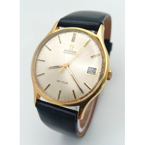 113 - A Vintage 18K Gold Omega Deville Automatic Gents Watch. Black leather strap. 18K gold case - 33mm. S... 