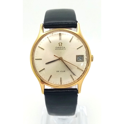 113 - A Vintage 18K Gold Omega Deville Automatic Gents Watch. Black leather strap. 18K gold case - 33mm. S... 