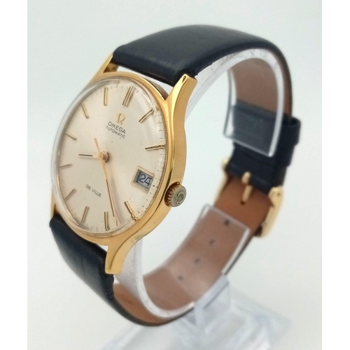 113 - A Vintage 18K Gold Omega Deville Automatic Gents Watch. Black leather strap. 18K gold case - 33mm. S... 