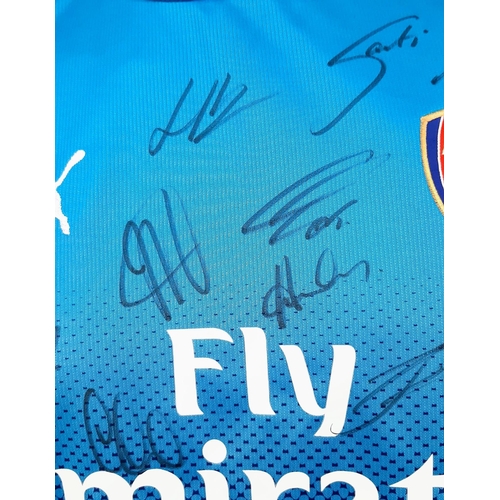 154 - A 2018 Arsenal Football Club Signed Away Fly Emirates (Puma) Blue Shirt. Fifteen signatures. Size XL... 