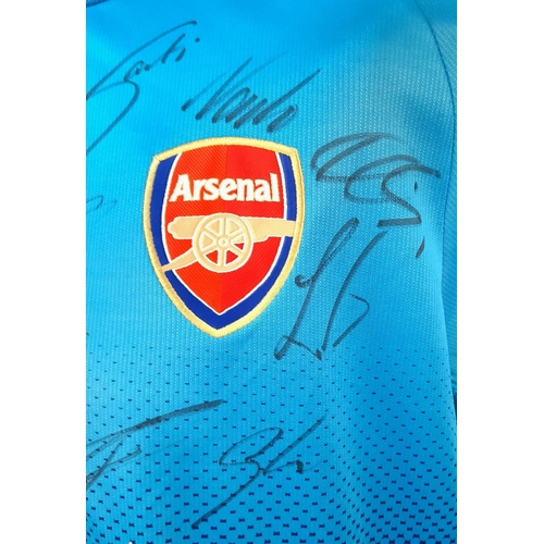 154 - A 2018 Arsenal Football Club Signed Away Fly Emirates (Puma) Blue Shirt. Fifteen signatures. Size XL... 