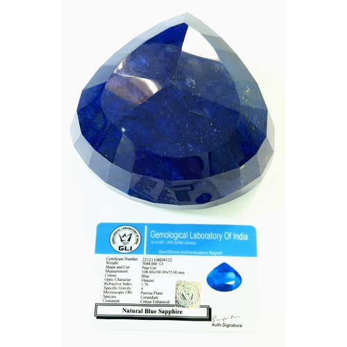 407 - A Massive 5048ct Earth Mined African Blue Sapphire. Pear Shape. GLI Certified. Colour Enhanced Gem.