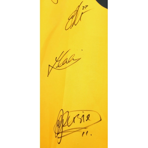 49 - An Arsenal Football Club Signed 2006 Away O2 Yellow Shirt. Fifteen signatures including: Van Persie,... 