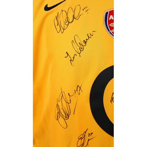 49 - An Arsenal Football Club Signed 2006 Away O2 Yellow Shirt. Fifteen signatures including: Van Persie,... 