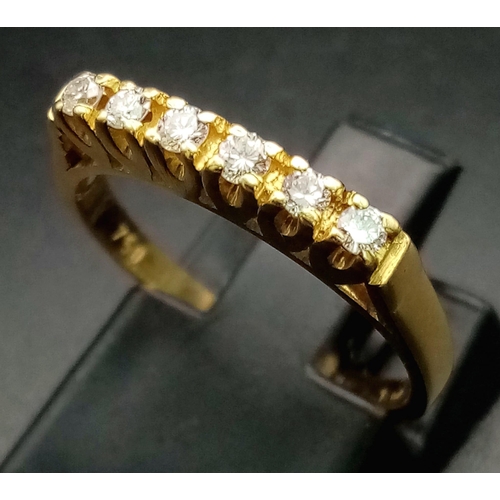 579 - An 18K Yellow Gold Half-Eternity Diamond Ring. Six diamonds - 0.30ctw. Size L. 2.6g total weight.