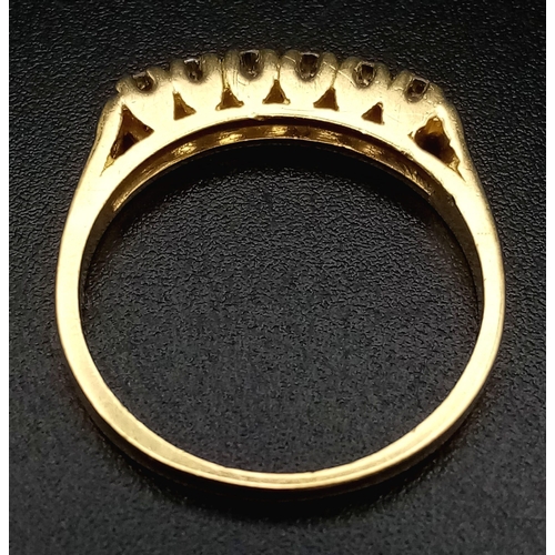 579 - An 18K Yellow Gold Half-Eternity Diamond Ring. Six diamonds - 0.30ctw. Size L. 2.6g total weight.