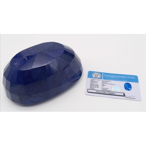 629 - A Gargantuan 6265ct Earth-Mined African Blue Sapphire Gemstone. Oval Shape. GLI Certified. This gems... 