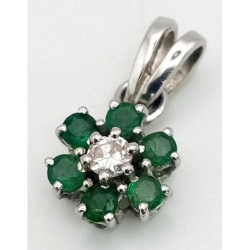 848 - 9ct White Gold Diamond and Emerald Pendant. Total weight 1.23grams