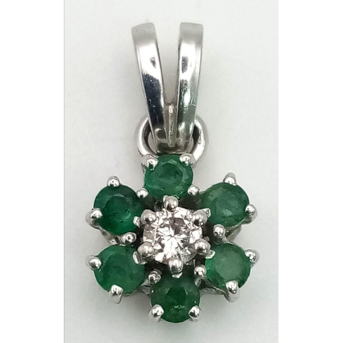 848 - 9ct White Gold Diamond and Emerald Pendant. Total weight 1.23grams