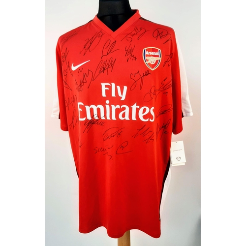 90 - An Arsenal Football Club 2008 Signed Home Emirates Red Shirt - Still with shop tags. 24 signatures. ... 