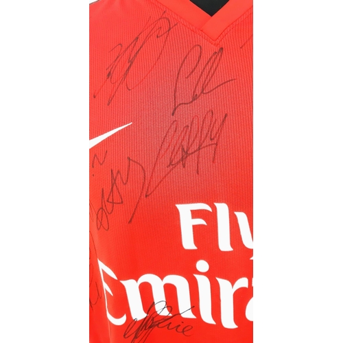 90 - An Arsenal Football Club 2008 Signed Home Emirates Red Shirt - Still with shop tags. 24 signatures. ... 