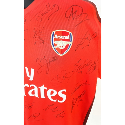 90 - An Arsenal Football Club 2008 Signed Home Emirates Red Shirt - Still with shop tags. 24 signatures. ... 