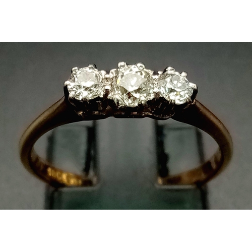 956 - An 18K Yellew Gold Diamond Trilogy Ring. 0.50ct. Size M. 
2.36g total weight.