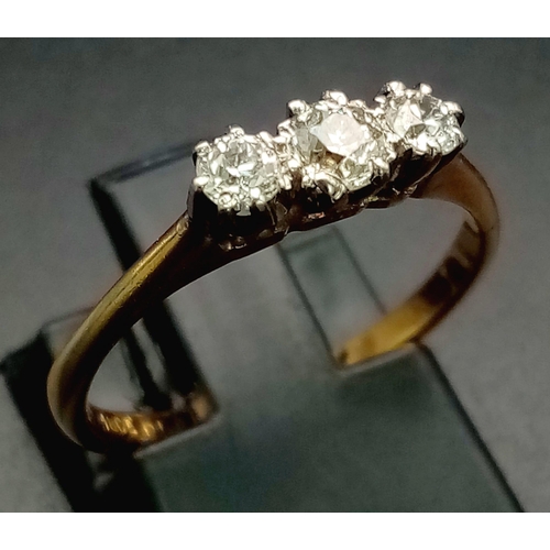 956 - An 18K Yellew Gold Diamond Trilogy Ring. 0.50ct. Size M. 
2.36g total weight.