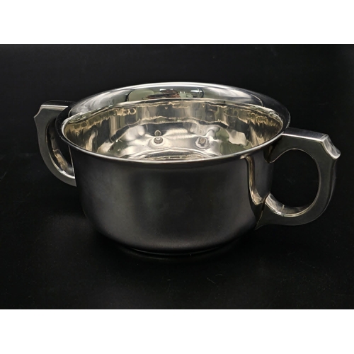 1365 - A SOLID SILVER TWIN HANDLED LOVING CUP HALLMARKED 1939 BIRMINGHAM . 140gms