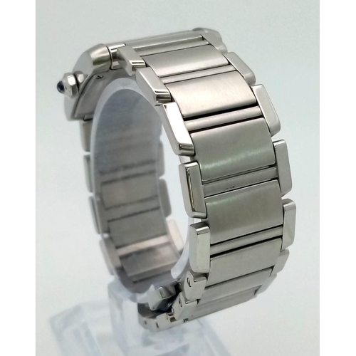 390 - A Cartier Tank Ladies Watch. Stainless steel bracelet and case - 25 x 28mm. White dial with Roman nu... 