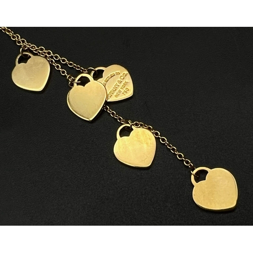 41 - A Tiffany and Co 18K Yellow Gold Five-Heart Necklace. 40cm - necklace. 8cm - hearts attachment. 10g ... 