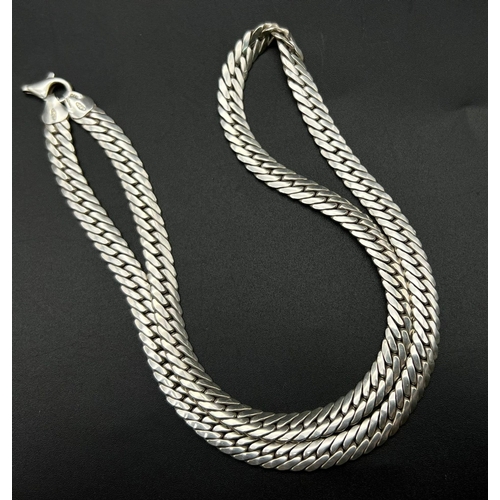 445 - A Hefty Reptilian Flat-Link 925 Silver Chain. 50cm. 49.65g