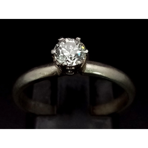 453 - An 18K White Gold Diamond Solitaire Ring. 0.40ct brilliant round cut white diamond - Si 1 clarity. S... 