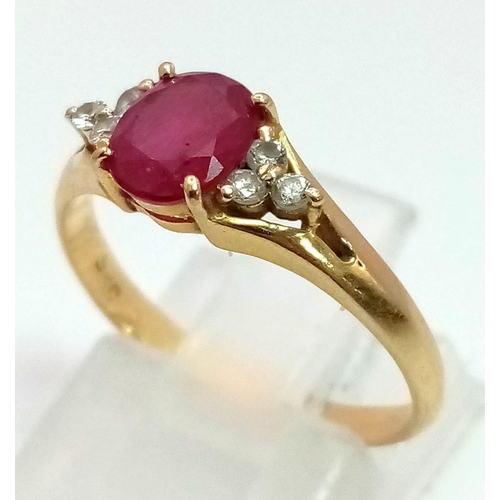 823 - A 14k Yellow Gold Ruby and Diamond Ring. A high-quality 1ct intense pink-red coloured central ruby w... 