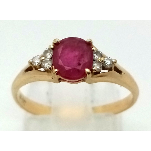 823 - A 14k Yellow Gold Ruby and Diamond Ring. A high-quality 1ct intense pink-red coloured central ruby w... 