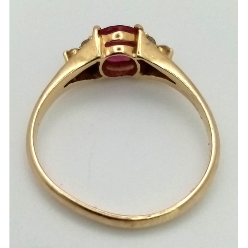 823 - A 14k Yellow Gold Ruby and Diamond Ring. A high-quality 1ct intense pink-red coloured central ruby w... 