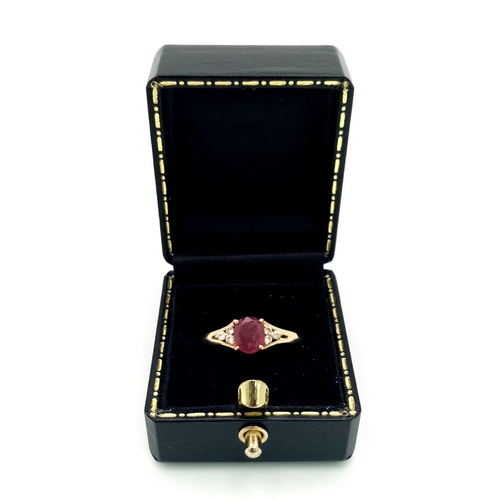 823 - A 14k Yellow Gold Ruby and Diamond Ring. A high-quality 1ct intense pink-red coloured central ruby w... 