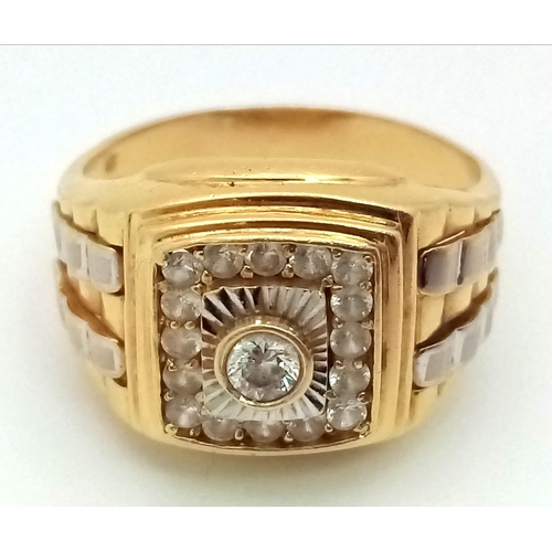 857 - An 18K Yellow Gold and White Cubic Zirconia Rolex Style Ring. Size Y. 10.5g total weight.