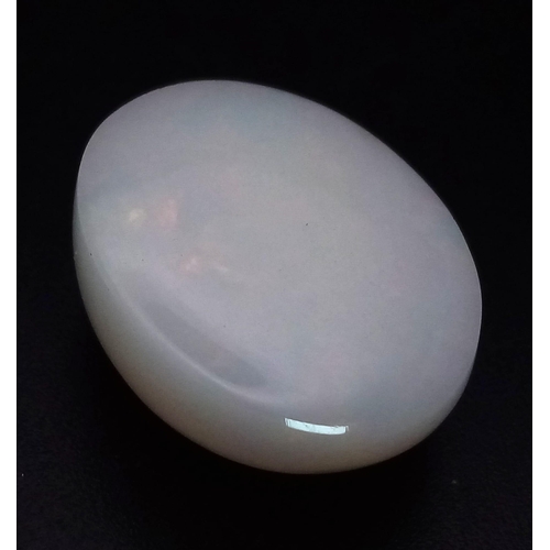 986 - An 18.61ct Natural Ethiopian Oval Opal with Colour-play effect. Comes with an ITLGR certificate.