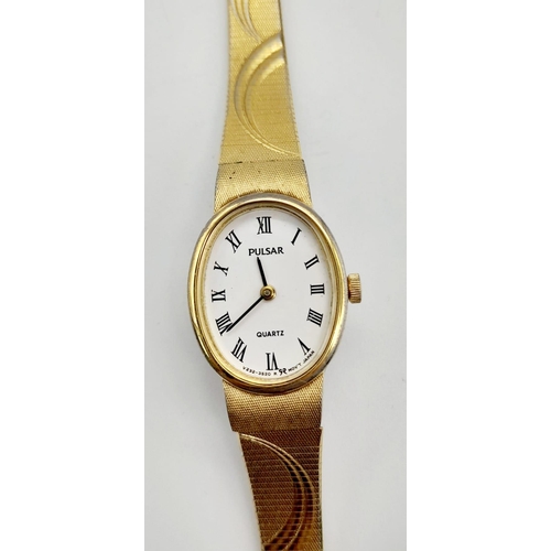 1155 - A ladies, gold plated PULSAR WATCH. Oval case 19 x 15 mm, white dial with Roman numerals, Japanese q... 