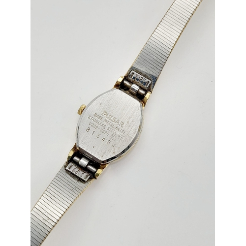 1155 - A ladies, gold plated PULSAR WATCH. Oval case 19 x 15 mm, white dial with Roman numerals, Japanese q... 