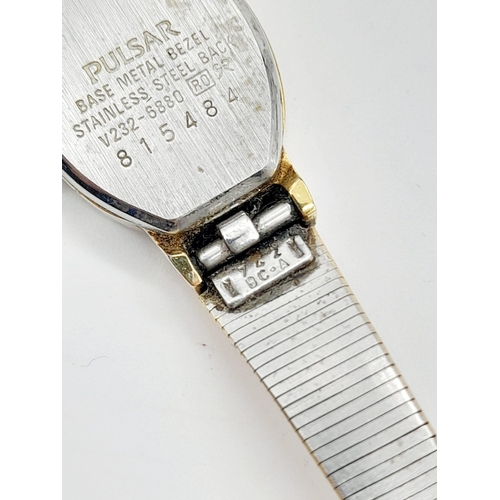 1155 - A ladies, gold plated PULSAR WATCH. Oval case 19 x 15 mm, white dial with Roman numerals, Japanese q... 