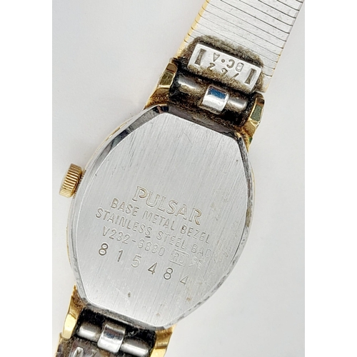 1155 - A ladies, gold plated PULSAR WATCH. Oval case 19 x 15 mm, white dial with Roman numerals, Japanese q... 