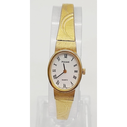 1155 - A ladies, gold plated PULSAR WATCH. Oval case 19 x 15 mm, white dial with Roman numerals, Japanese q... 