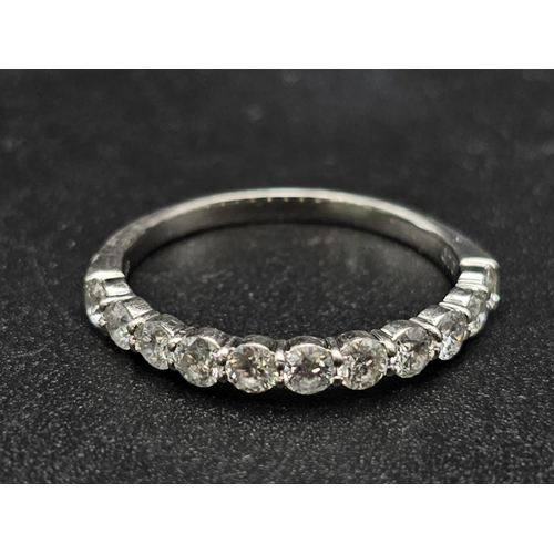 181 - A half eternity platinum diamond (0.70 carats) ring. Good quality  white diamonds VVS, ring size: M,... 