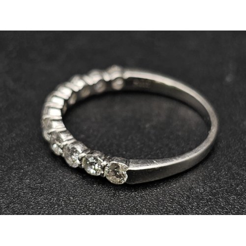 181 - A half eternity platinum diamond (0.70 carats) ring. Good quality  white diamonds VVS, ring size: M,... 