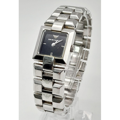 635 - A solid stainless steel |EMPORIO ARMANI ladies watch. Square dial 18 mm, black dial, quartz movement... 