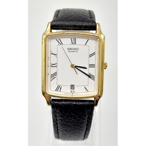 748 - A gold plated SEIKO watch. Case 27 x 25 mm, white dial with Roman numerals, Japanese quartz movement... 