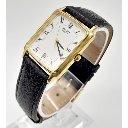 748 - A gold plated SEIKO watch. Case 27 x 25 mm, white dial with Roman numerals, Japanese quartz movement... 